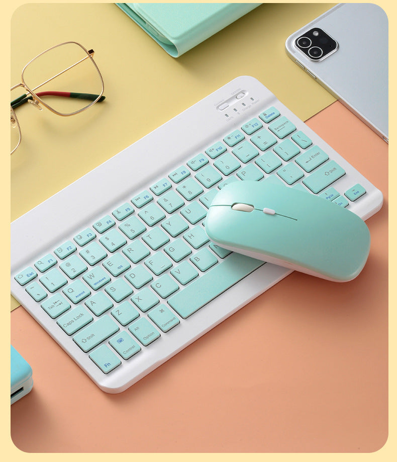 Mouse Dual-mode Charging Wireless Mouse with a mint green keyboard and accessories on a pastel background.