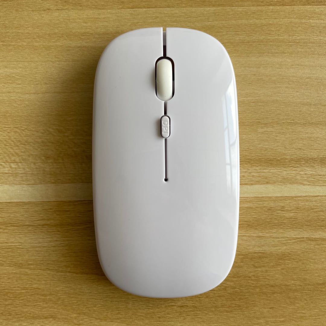 Mouse Dual-mode Charging Wireless Mouse on a wooden surface with a sleek design and four buttons.
