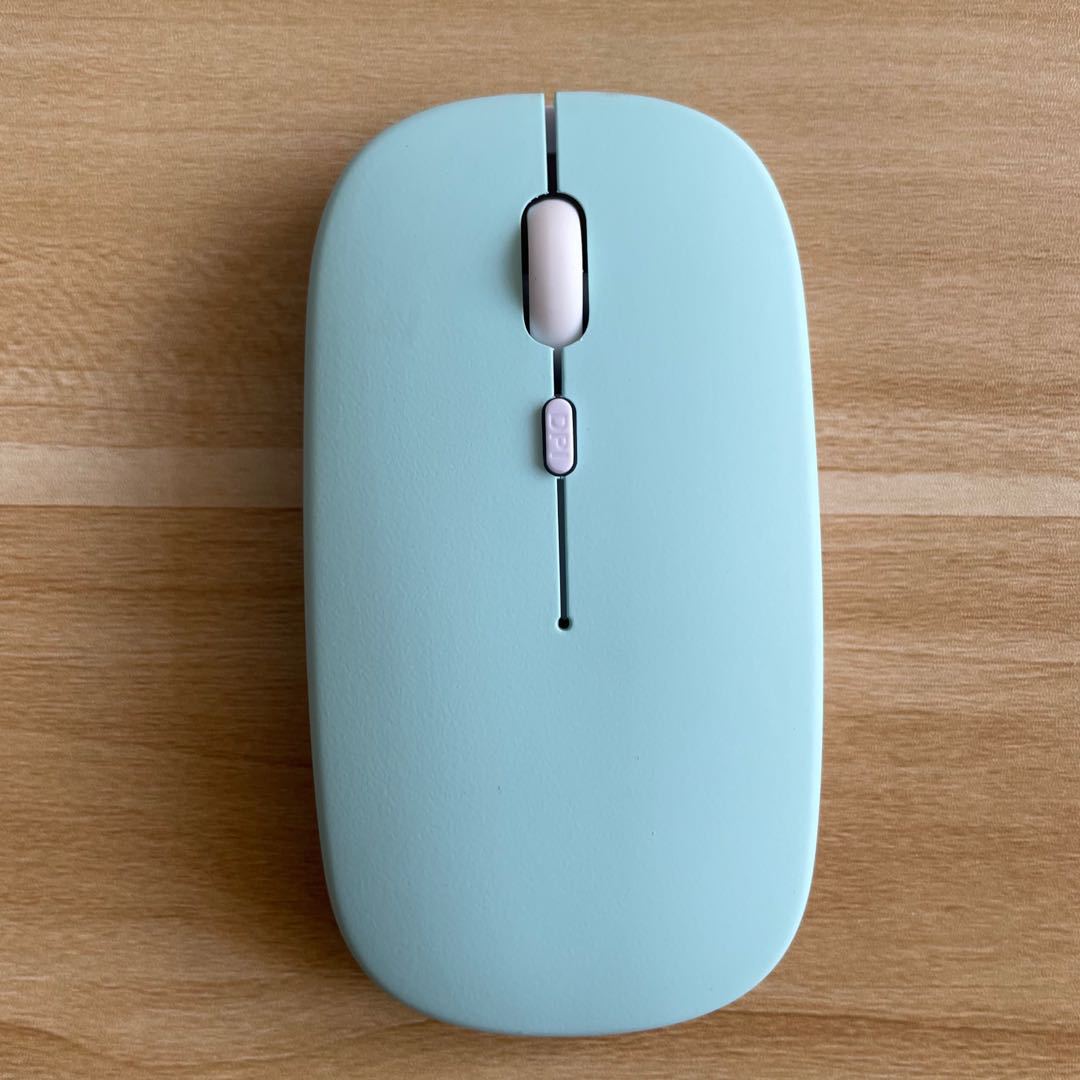 Mouse Dual-mode Charging Wireless Mouse in light blue color on a wooden surface