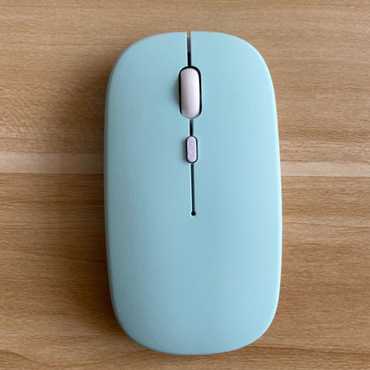 Mouse Dual-mode Charging Wireless Mouse in light blue color on a wooden surface